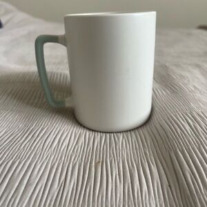 Elegant White Mug with Green Handle